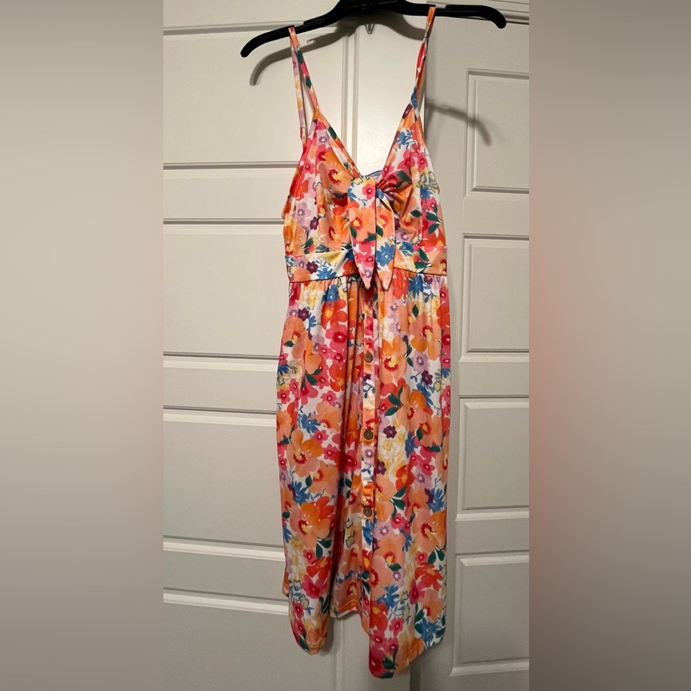 BRAND NEW VotePretty Colorful Floral Dress with Bow and cutout at front.